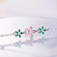 Zilveren armband  groen- roze bloemetje