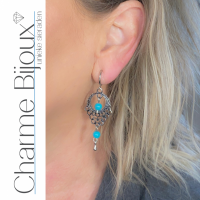 Klem oorbellen turquoise zilverkleur 6 cm